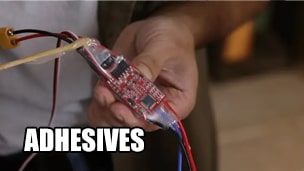 What are the common adhesives used for circuit boards?